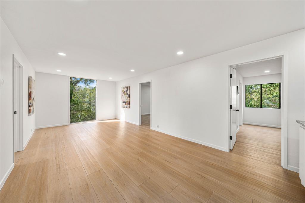 3020 North 43rd Street Waco, TX 76708 - Photo 19 of 40 a view of a big room with wooden floor and windows