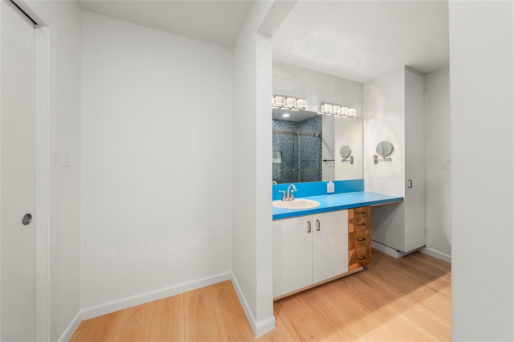 3020 North 43rd Street Waco, TX 76708 - Photo 21 of 40 a bathroom with a sink and a mirror