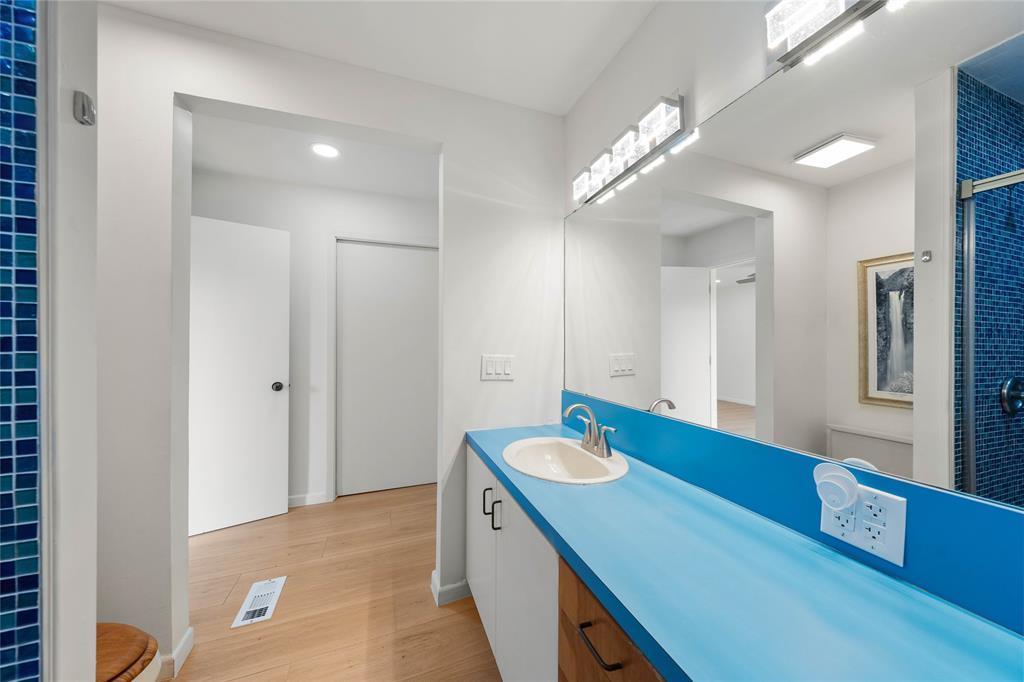 3020 North 43rd Street Waco, TX 76708 - Photo 24 of 40 a bathroom with a sink double vanity and a mirror