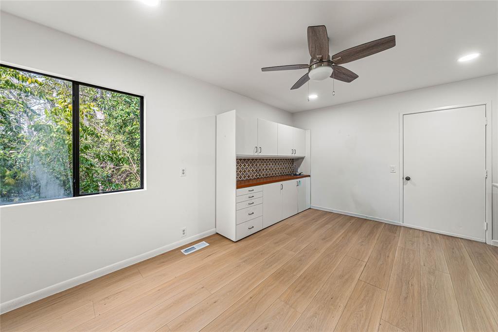 3020 North 43rd Street Waco, TX 76708 - Photo 31 of 40 a view of an empty room with a window and wooden floor