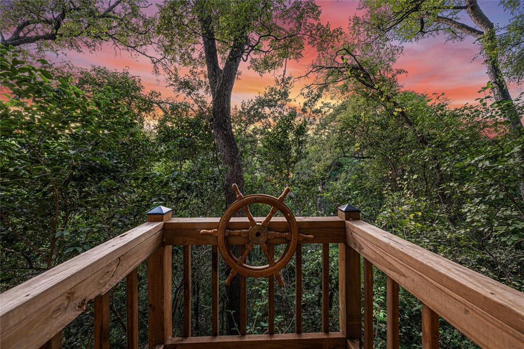 3020 North 43rd Street Waco, TX 76708 - Photo 37 of 40 a view of a roof deck with wooden fence and floor