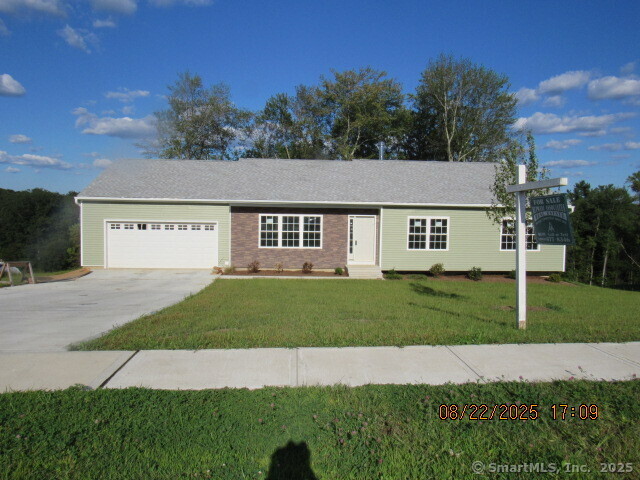 a view of a big house with a yard