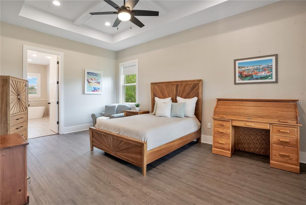 440 Palma Ceia Road Winter Haven, FL 33884 - Photo 27 of 78 a bedroom with a bed and a fireplace