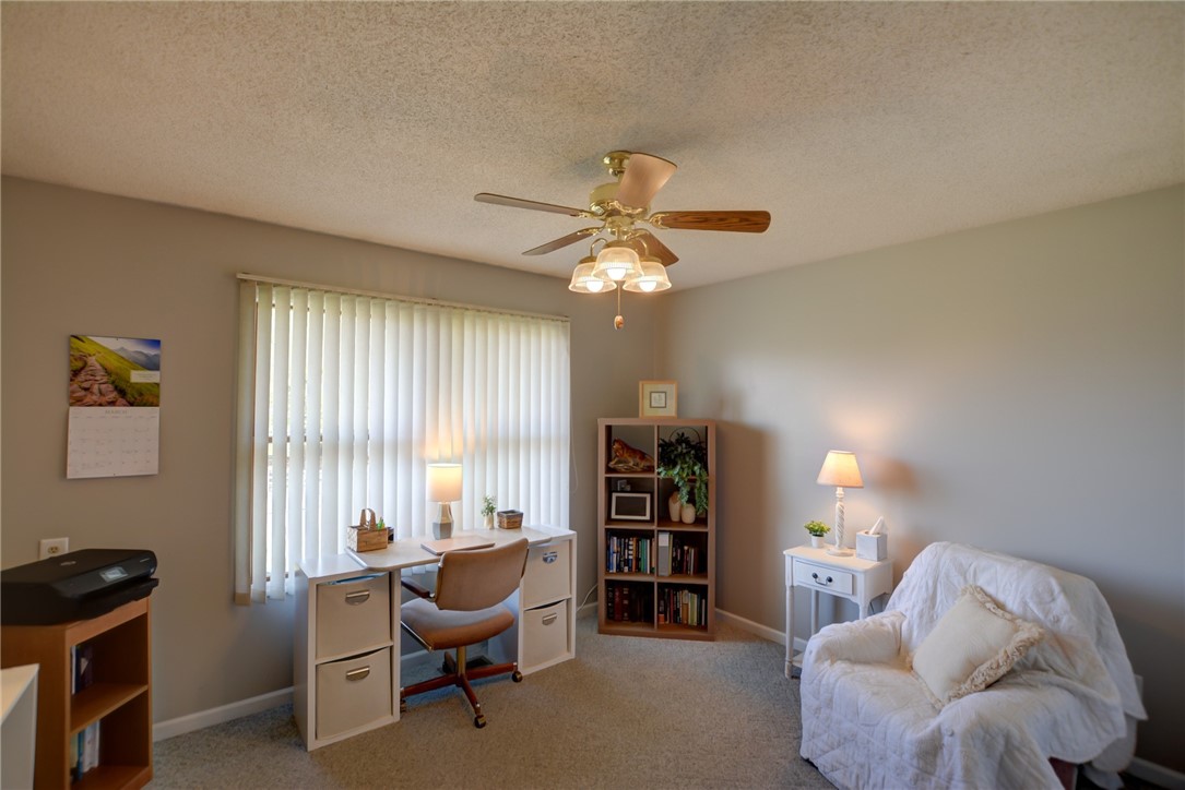 4095 West Rock Springs Road Decatur, IL 62522 - Photo 18 of 48 a living room with furniture and a window