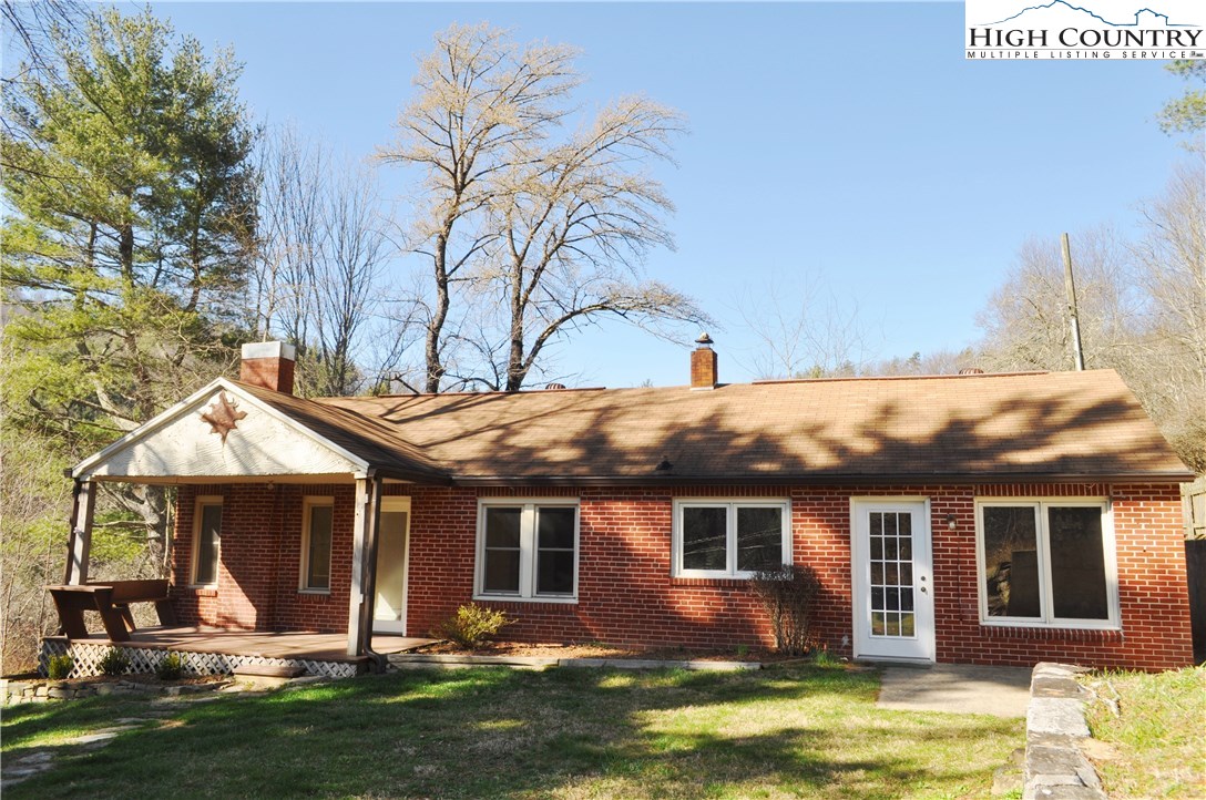 309 Old Blowing Rock Road Boone, NC 28607 - Photo 1 of 26 a front view of a house with garden