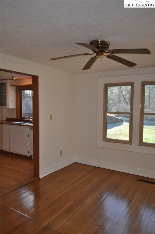 309 Old Blowing Rock Road Boone, NC 28607 - Photo 11 of 26 an empty room with wooden floor closet and windows