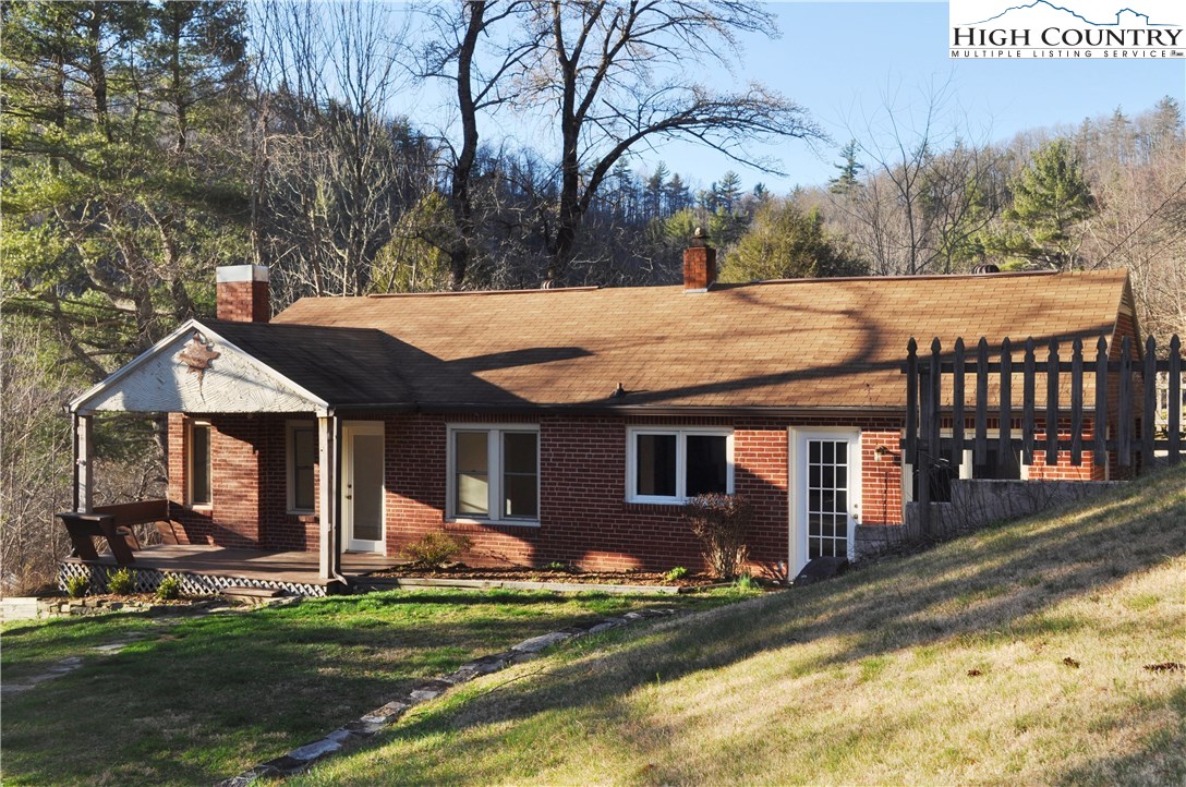 309 Old Blowing Rock Road Boone, NC 28607 - Photo 2 of 26 a view of a house with backyard and sitting area