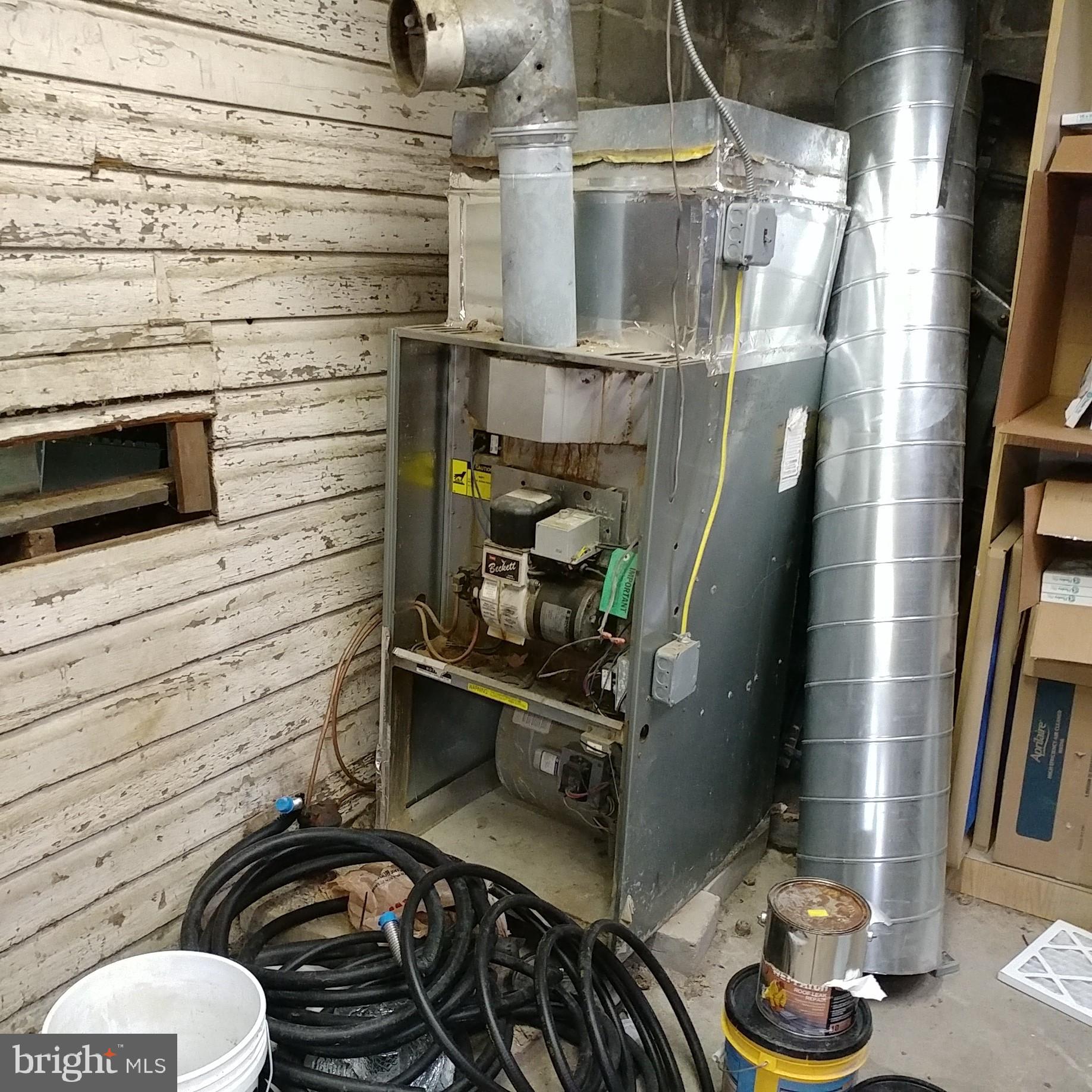 57 East Eagle Road Havertown, PA 19083 - Photo 16 of 19 Oil Heater (not functioning) behind garage entry