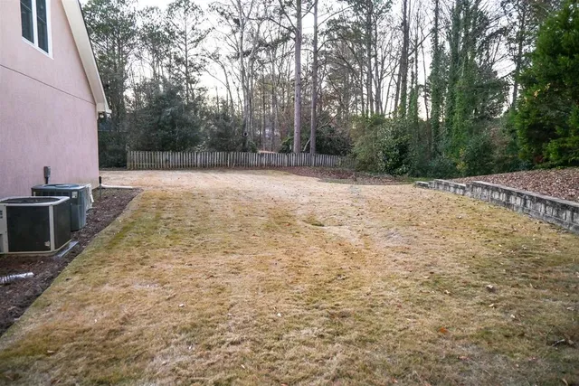 a view of a backyard of the house