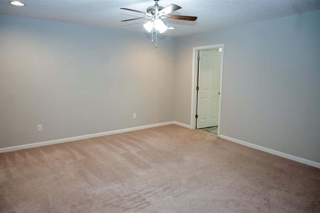 4847 Champion's Way Columbus, GA 31909 - Photo 19 of 39 an empty room with a fan & a window