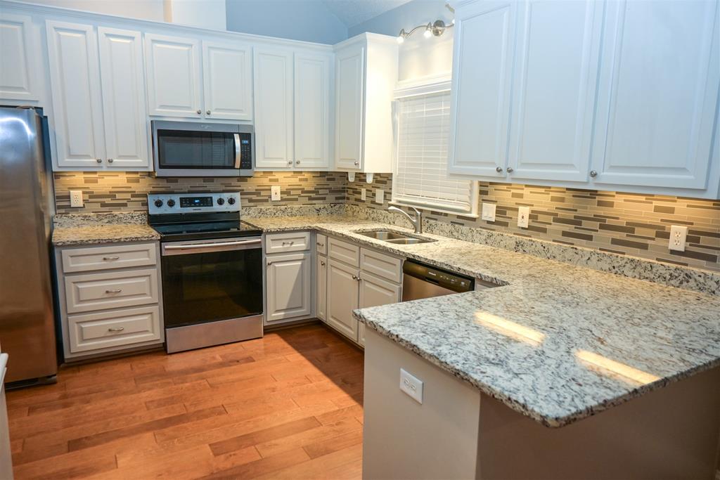 4847 Champion's Way Columbus, GA 31909 - Photo 2 of 39 a kitchen with a sink stove and microwave