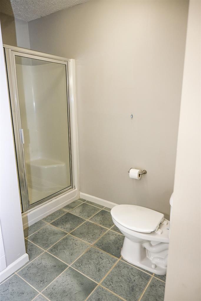 4847 Champion's Way Columbus, GA 31909 - Photo 22 of 39 a bathroom with a toilet and a shower