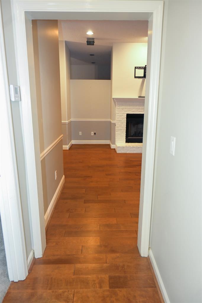 4847 Champion's Way Columbus, GA 31909 - Photo 25 of 39 a view of hallway with a fireplace and a rug