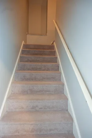 a view of an empty room with a bathroom
