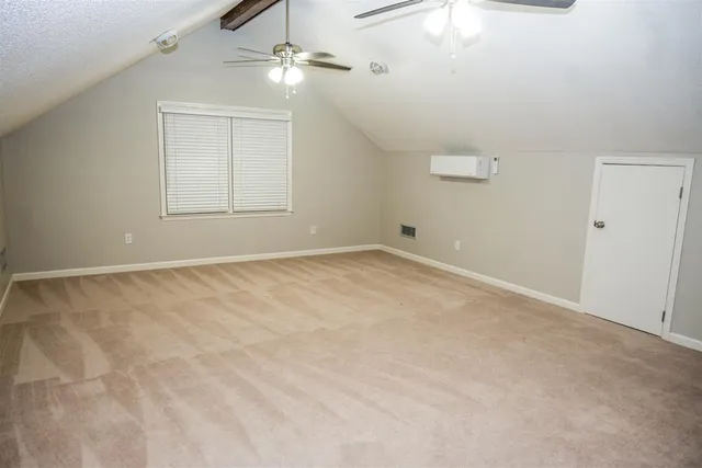 a bathroom with a glass door shower and a mirror