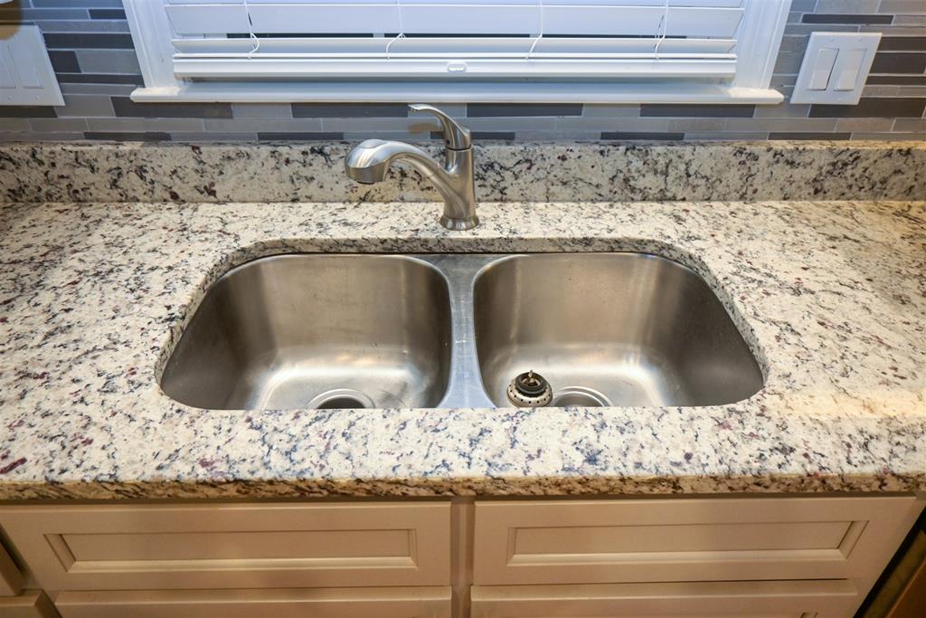 4847 Champion's Way Columbus, GA 31909 - Photo 4 of 39 a sink with granite top and granite counter top