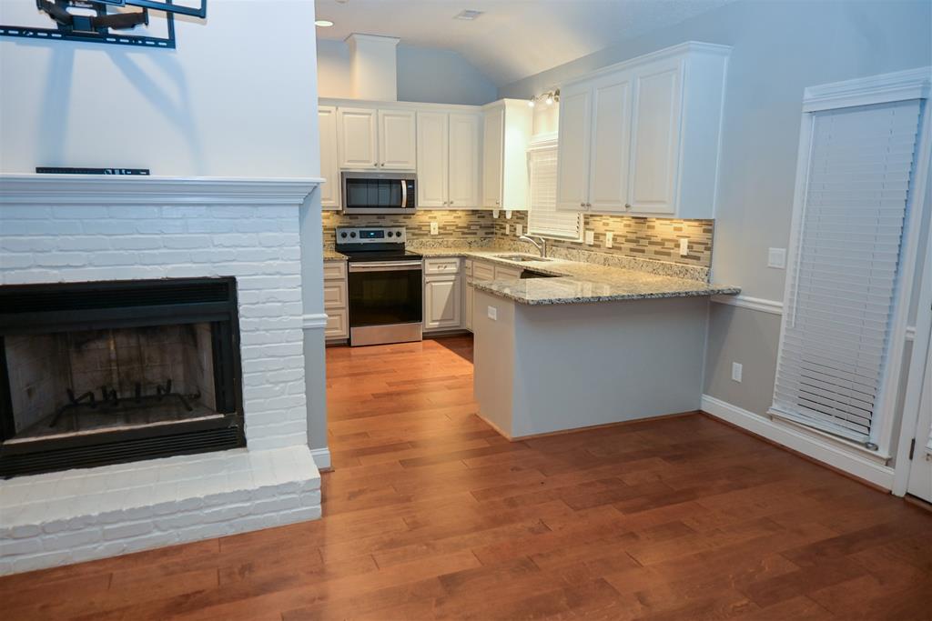 4847 Champion's Way Columbus, GA 31909 - Photo 5 of 39 a kitchen with a sink stove and cabinets