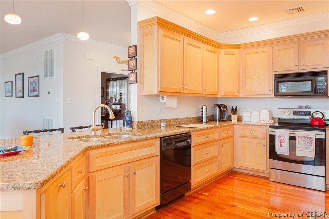 102 Ferry Road Hartfield, VA 23071 - Photo 30 of 42 Granite Countertops and Solid Maple Cabinets in the Kitchen