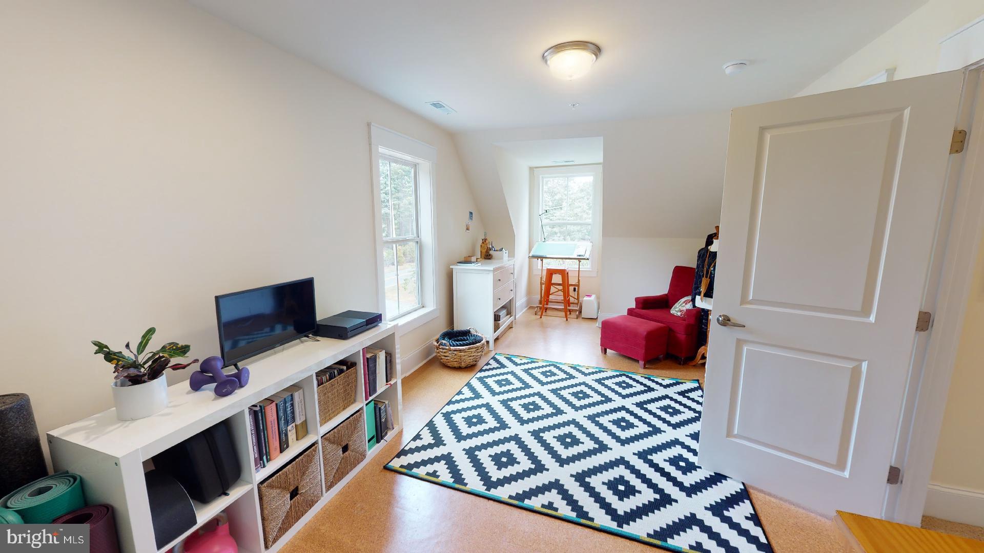 321 Front Street Crumpton, MD 21628 - Photo 19 of 27 Upstairs bedroom 2 w/ cork flooring