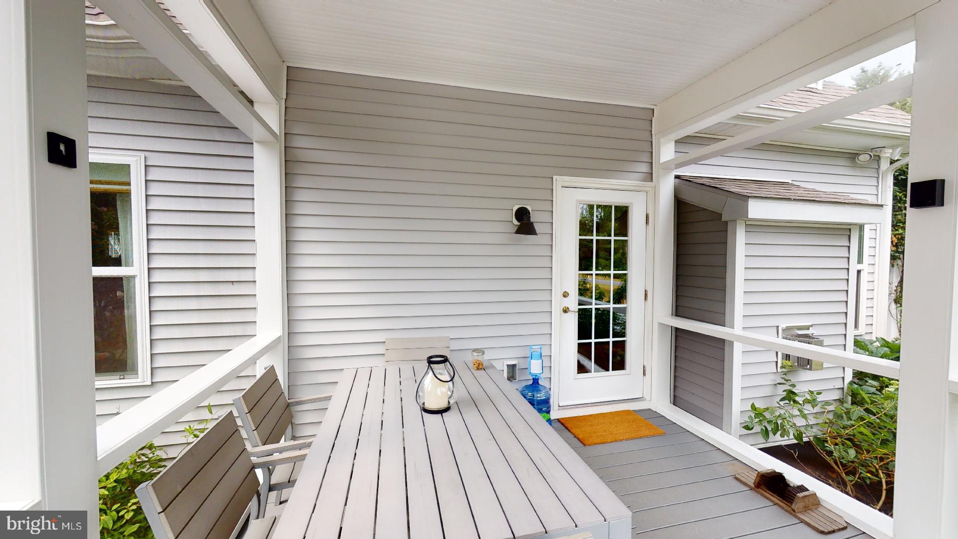321 Front Street Crumpton, MD 21628 - Photo 23 of 27 Side porch with room for a table