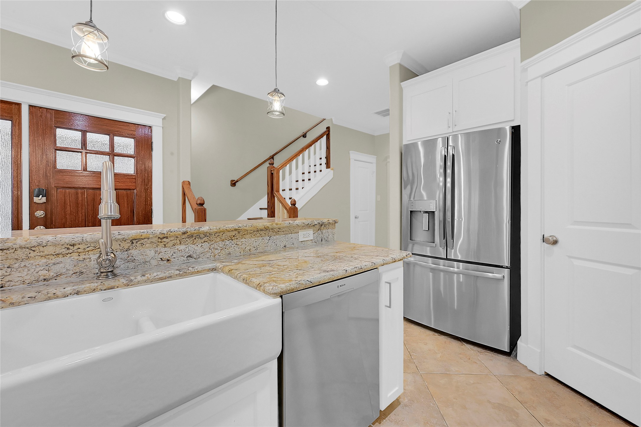 4418 Edsee Street Houston, TX 77009 - Photo 9 of 28 An oversized farm-style sink and shimmering stainless steel appliances elevate the space, making clean up's feel not so chore-like.