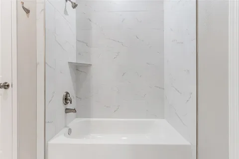 a close up of a bathtub curtain