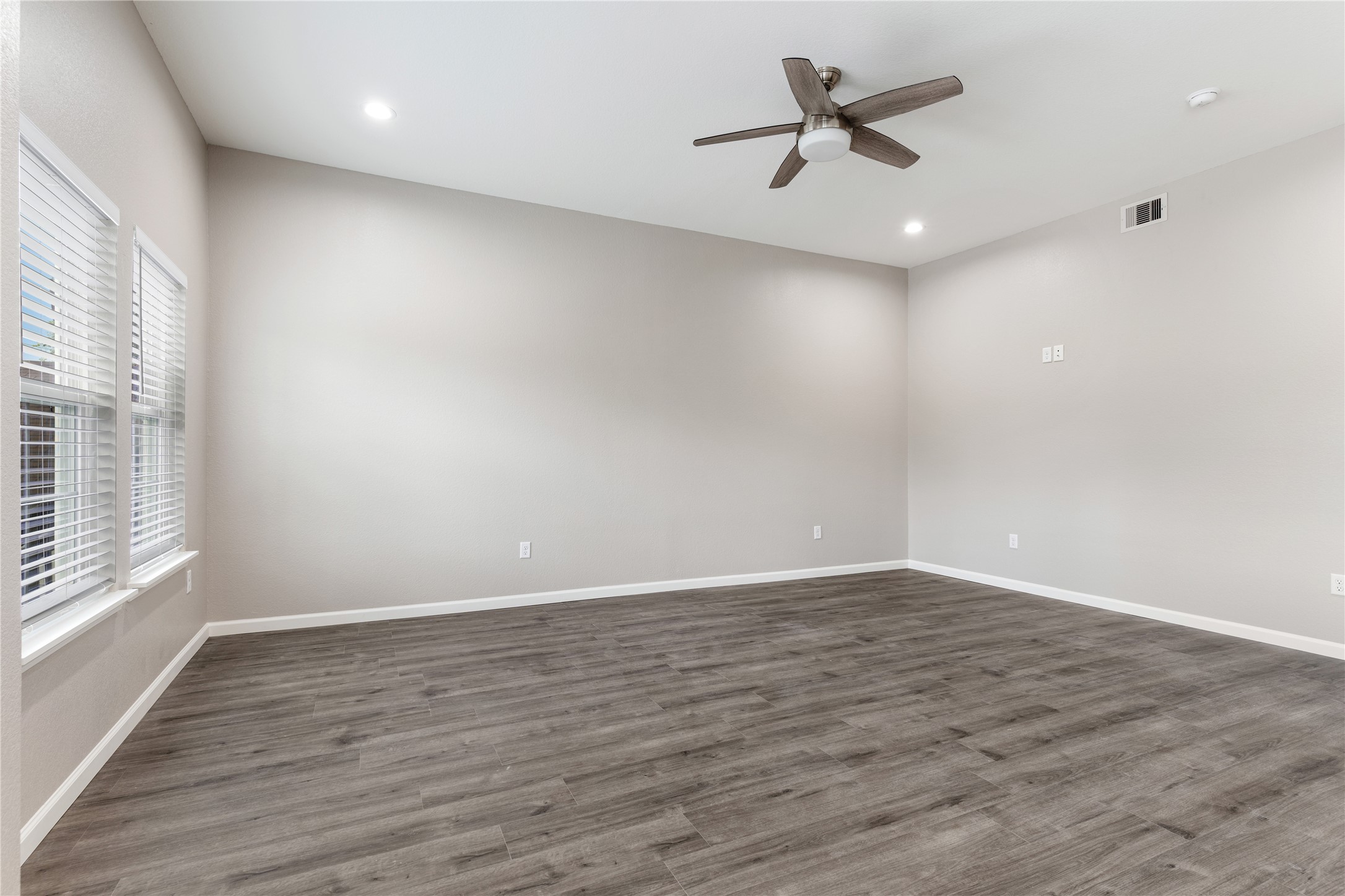 1321 East 35th Street Houston, TX 77022 - Photo 7 of 24 wooden floor in an empty room with a window