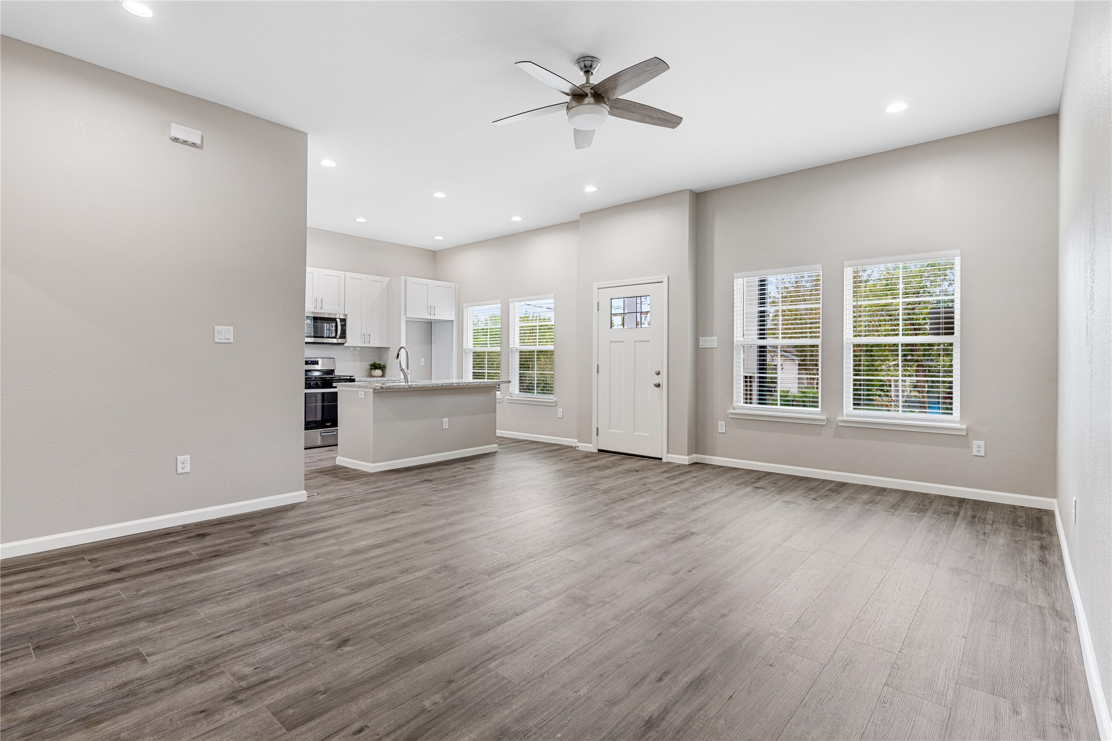 1321 East 35th Street Houston, TX 77022 - Photo 9 of 24 a view of an empty room with a window and wooden floor