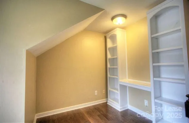 a bathroom with a mirror and a shower