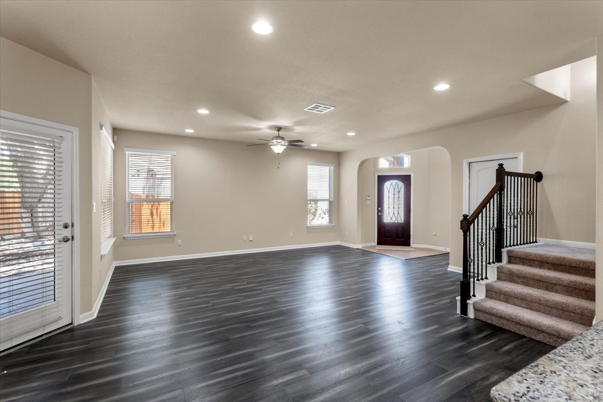 3451 Mayfield Ranch Boulevard, Unit 311 Round Rock, TX 78681 - Photo 6 of 40 Spacious room featuring dark wood-finish flooring, recessed lighting, and a ceiling fan