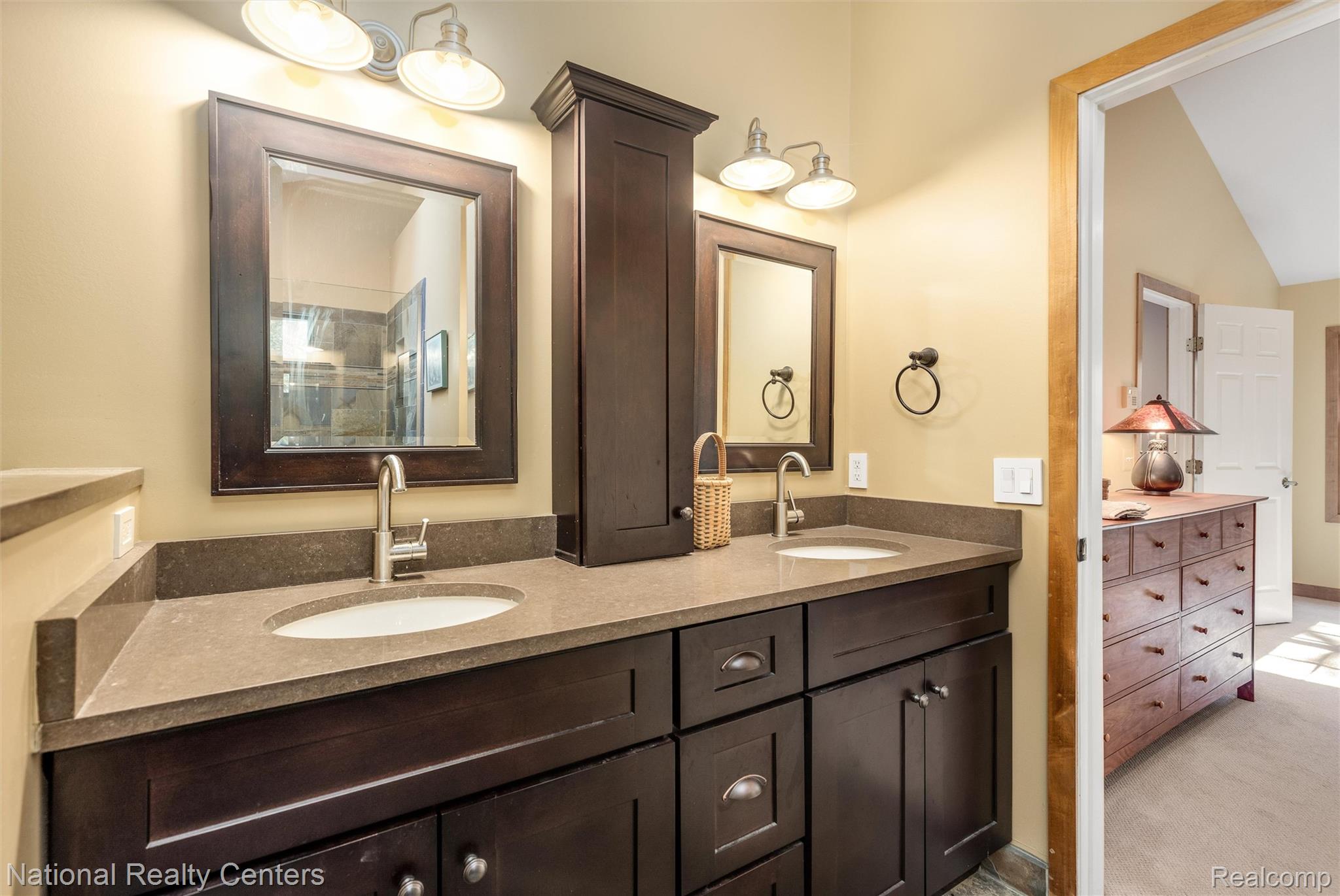 2322 Addaleen Road Highland, MI 48357 - Photo 36 of 54 Ensuite bathroom with double vanity and baseboards