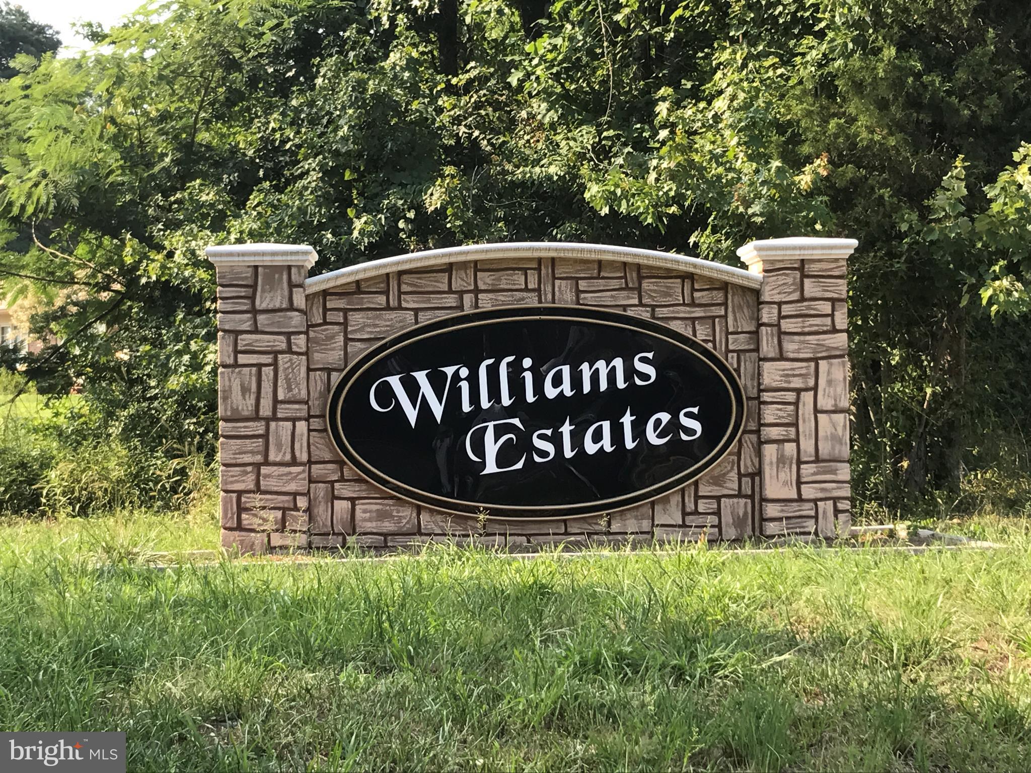 a view of garden with sign board and yard