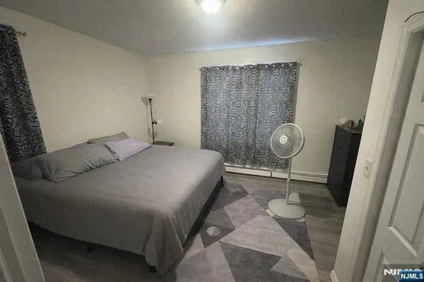 a bedroom with a bed and a window in it