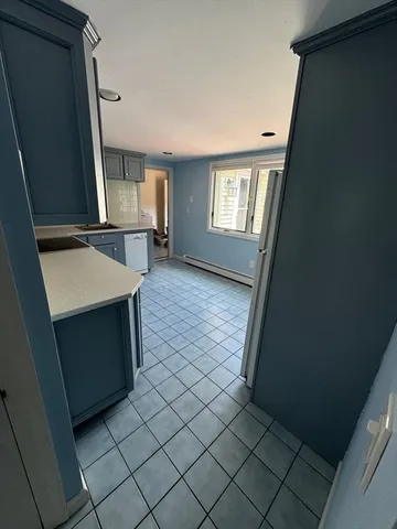 a view of a kitchen from the hallway