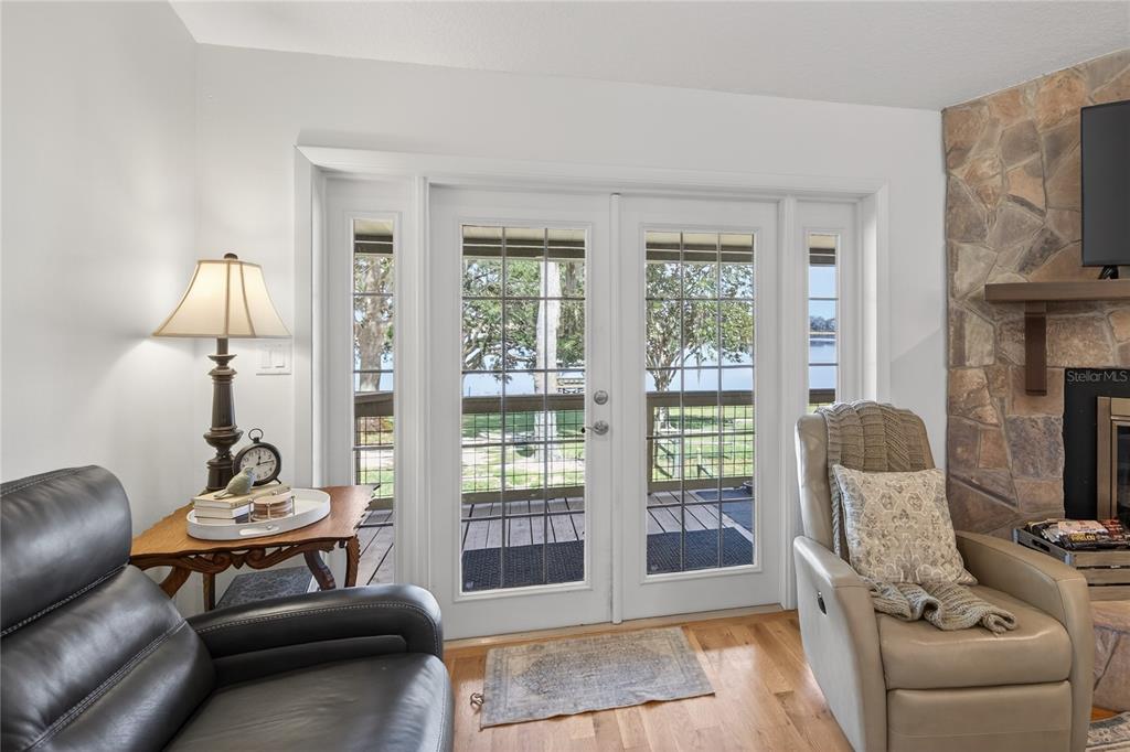 17025 Peru Road Umatilla, FL 32784 - Photo 14 of 73 a living room with furniture and a floor to ceiling window