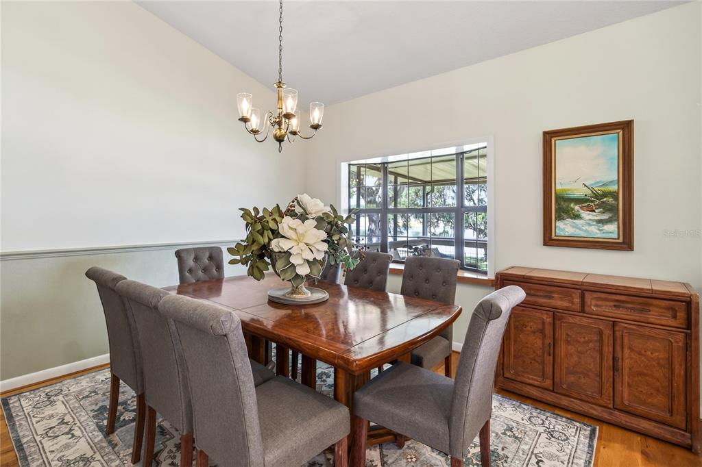 17025 Peru Road Umatilla, FL 32784 - Photo 16 of 73 a view of a dining room with furniture window and wooden floor
