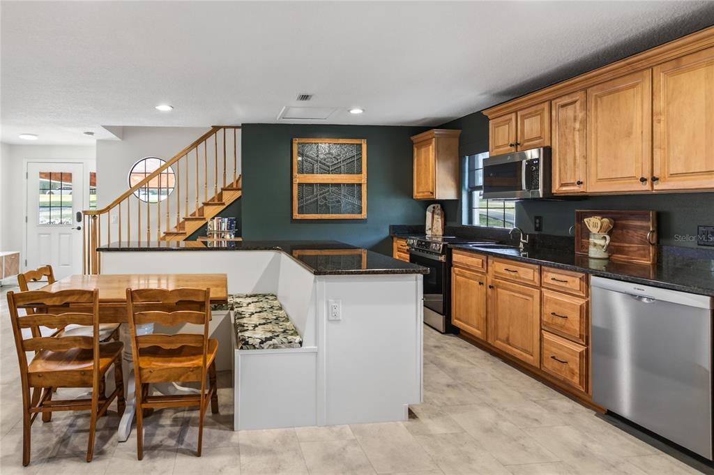 17025 Peru Road Umatilla, FL 32784 - Photo 18 of 73 a kitchen with cabinets a sink and appliances
