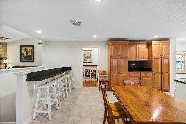 a kitchen with stainless steel appliances a refrigerator and cabinets