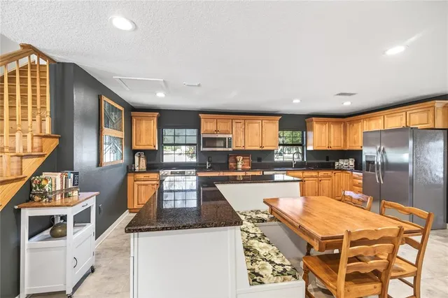 a bathroom with a double vanity sink toilet mirror and bathtub