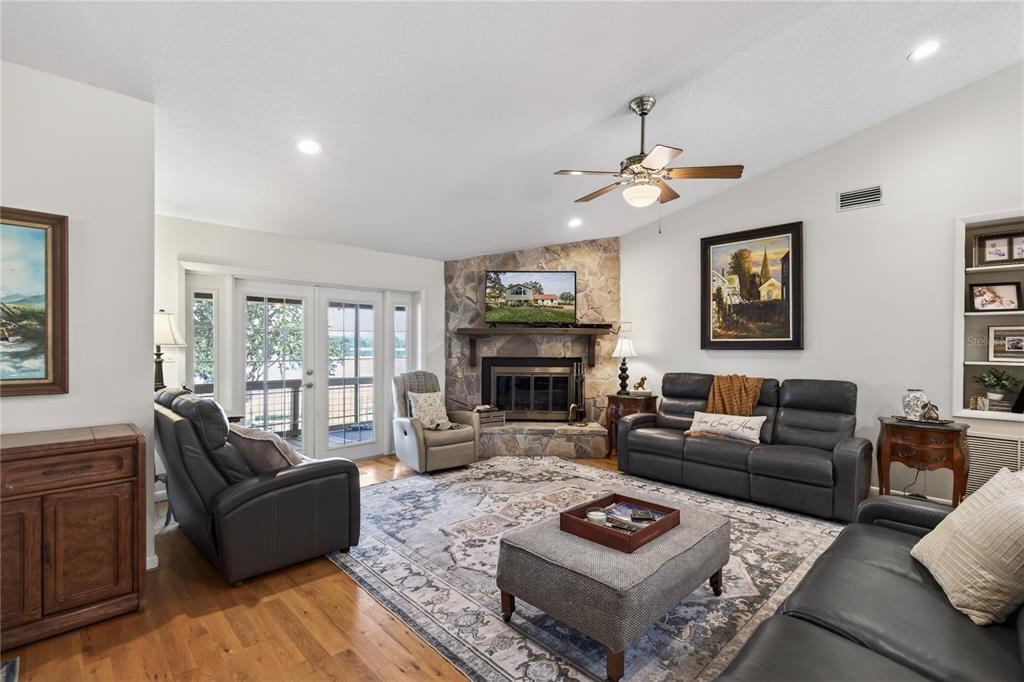 17025 Peru Road Umatilla, FL 32784 - Photo 25 of 73 a living room with furniture and a fireplace