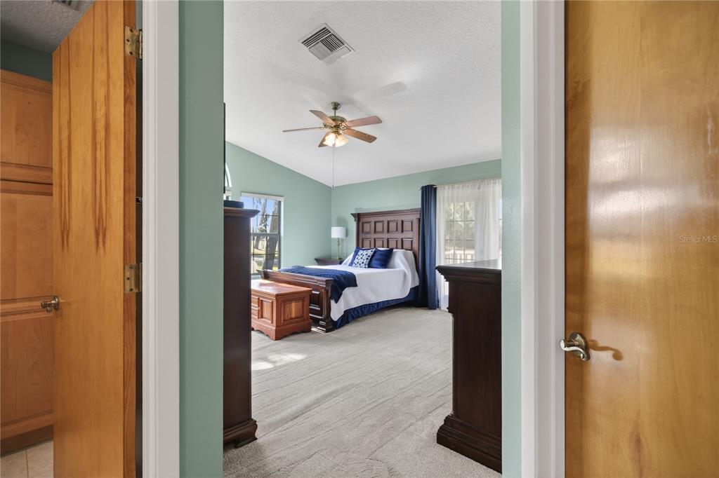 17025 Peru Road Umatilla, FL 32784 - Photo 34 of 73 a living room with furniture and a chandelier