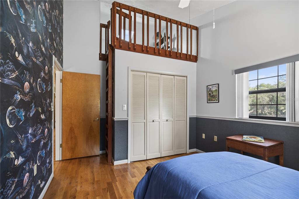 17025 Peru Road Umatilla, FL 32784 - Photo 39 of 73 a bedroom with a bed and a window