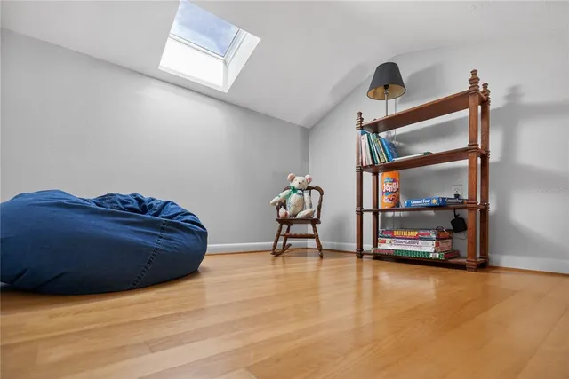 a bathroom with a toilet a sink and a window