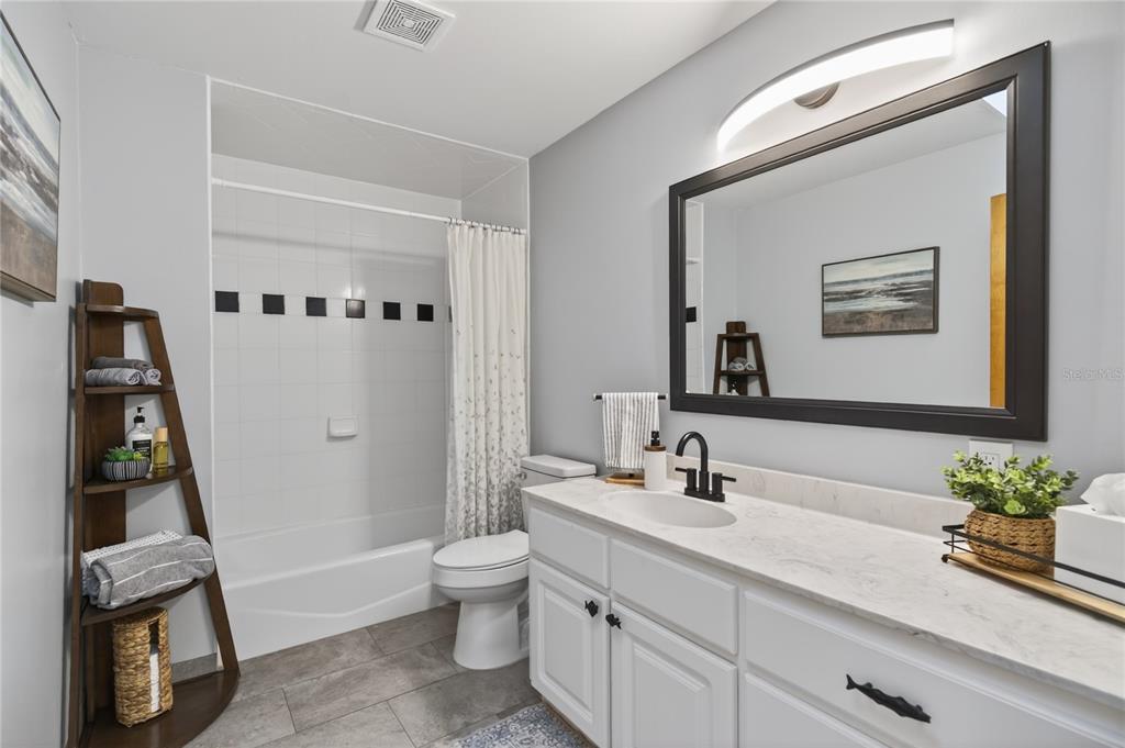 17025 Peru Road Umatilla, FL 32784 - Photo 41 of 73 a bathroom with a sink a toilet and a mirror