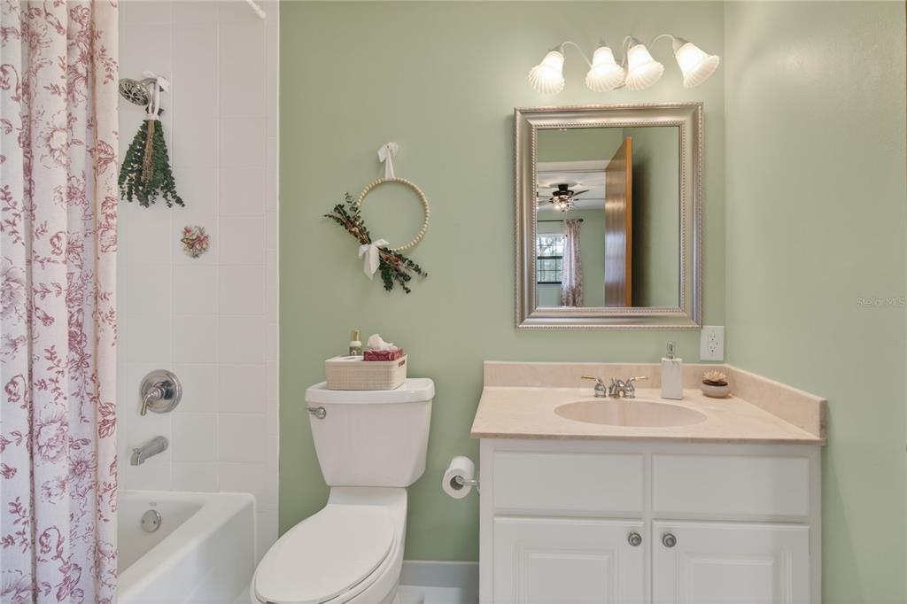 17025 Peru Road Umatilla, FL 32784 - Photo 46 of 73 a bathroom with a sink mirror and toilet