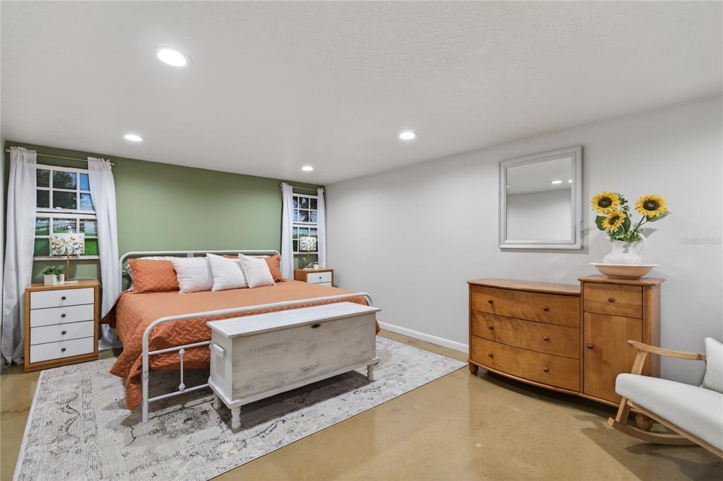 17025 Peru Road Umatilla, FL 32784 - Photo 48 of 73 a bed room with a bed and a chair