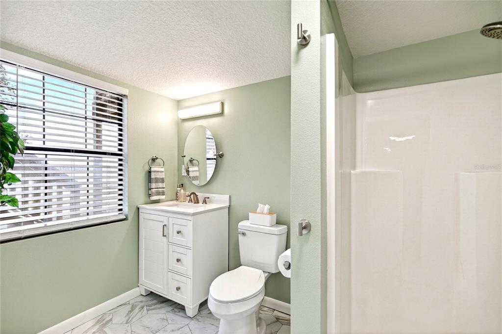 17025 Peru Road Umatilla, FL 32784 - Photo 52 of 73 a bathroom with a toilet a sink and a window