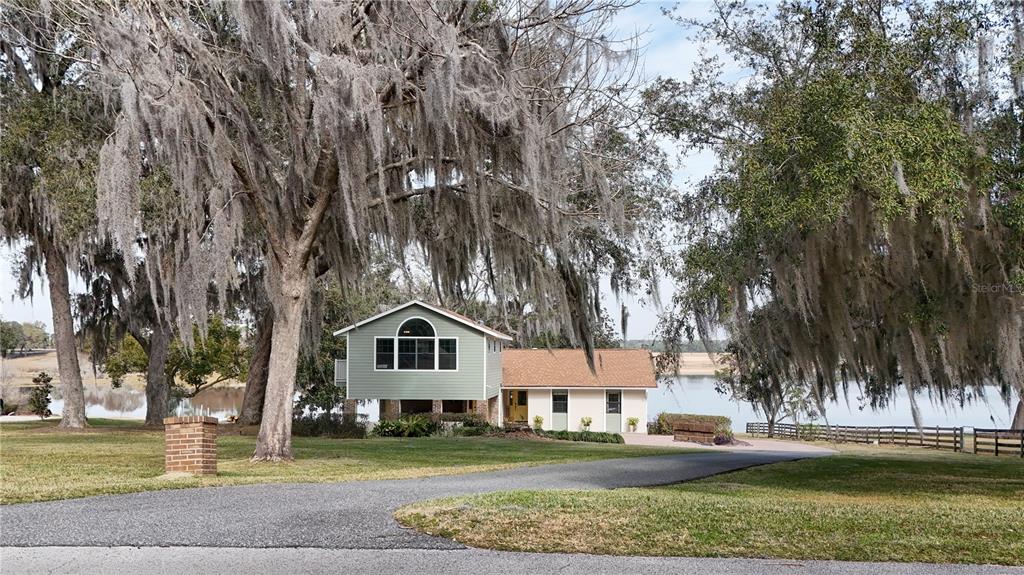 17025 Peru Road Umatilla, FL 32784 - Photo 60 of 73 a front view of a house with a yard