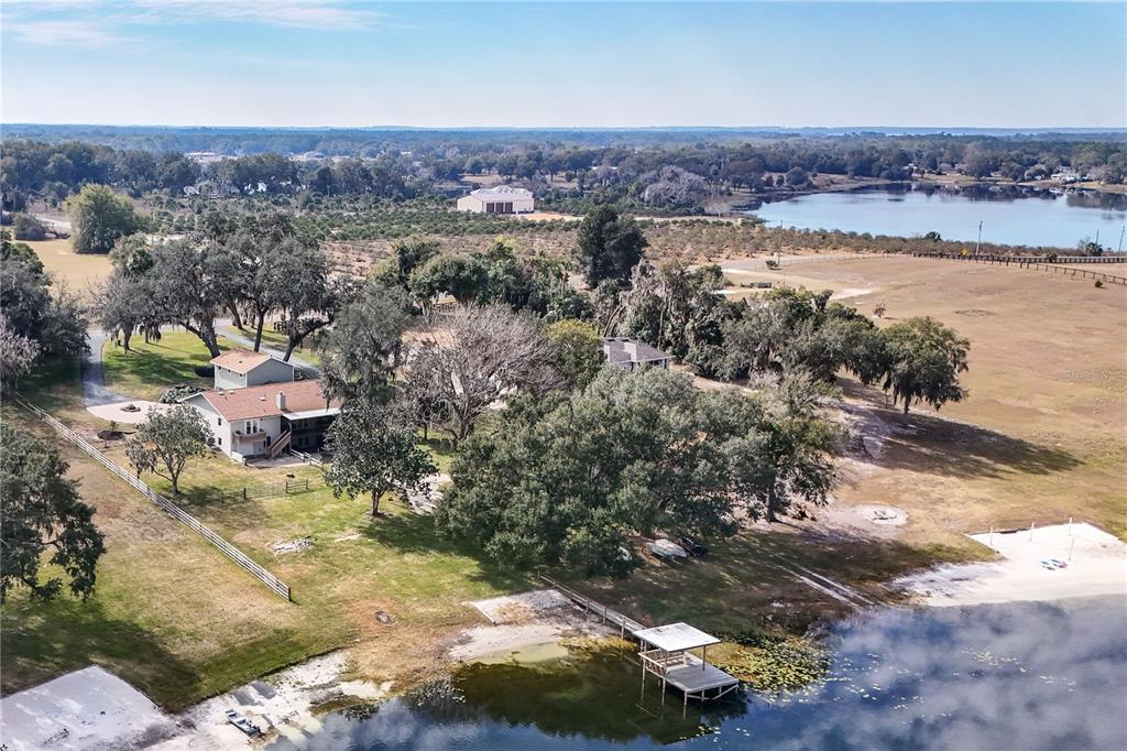 17025 Peru Road Umatilla, FL 32784 - Photo 66 of 73 an aerial view of a house with a yard and lake view
