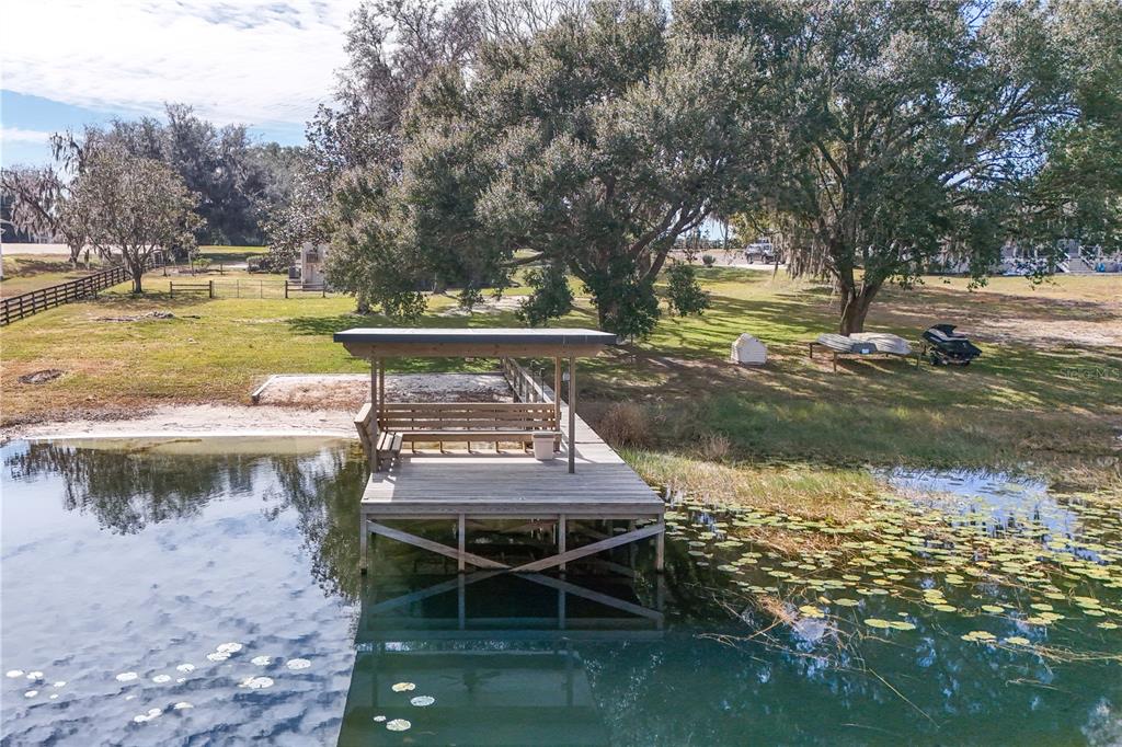 17025 Peru Road Umatilla, FL 32784 - Photo 68 of 73 a view of a lake with a large trees